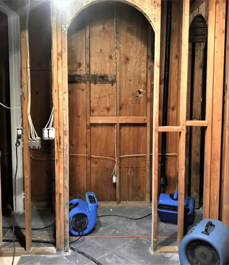 Water-damaged interior being dried in a Tustin, CA home
